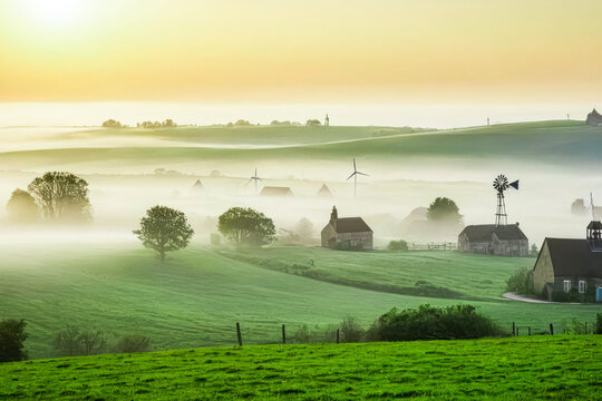 A Foggy Sunrise Over a Serene Village Landscape