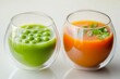© muqadas - Two tulip-shaped glasses, one brimming with fresh spring pea soup, the other with carrot ginger juice, a burst of spring colors on white.