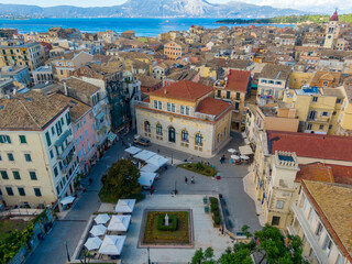 Coastal town square, aerial view.  Buildings, shops, and a central plaza.