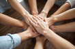 © ribalka yuli - United Hands Displaying Teamwork and Support. A group of hands joined together in solidarity, symbolizing teamwork, support, and mutual collaboration.