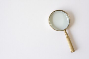 Poster - A close-up shot of a magnifying glass on a table, ideal for use in educational or scientific contexts