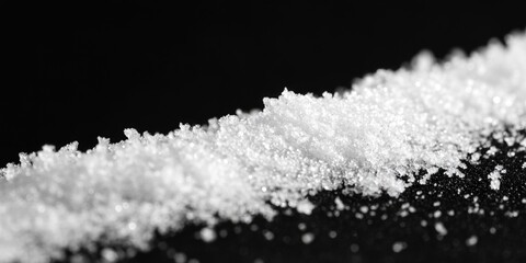 Poster - A small pile of sugar sits on top of a table, ready for use in cooking or baking