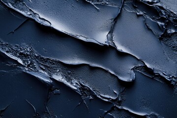 Poster - Close-up shot of a cracked surface with blue paint, suitable for use in designs related to art or construction