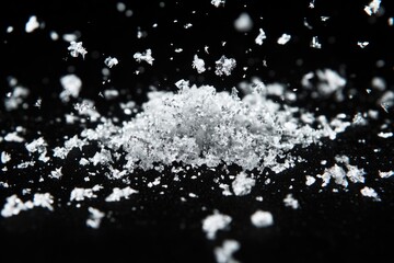 Poster - A pile of white sugar on a dark background, suitable for use in food or decoration photography