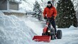 © dominic - Snow Removal Operator Using Powerful Snowblower Machine in Winter