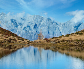 Wall Mural - Autumn alpine Kleiner Paarsee or Paarseen lake, Land Salzburg, Austria. Alps Hochkonig rocky mountain group view in far.