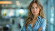© kosoff - Young confident business woman, successful entrepreneur, elegant professional company manager, wearing blouse, standing in office with crossed arms. Portrait