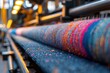 © Ameli Studio - Fabric industrial loom producing multicolored textile factory angled view