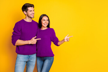 Poster - Profile side photo of two charming people point at copy space show promo wear red sweater denim jeans isolated over yellow background