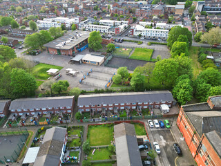 Wall Mural - Aerial View of Buildings at Greater Manchester Central City, Northwest of England, United Kingdom. Aerial View Footage Was Captured with Drone's Camera on May 4th, 2024 During Sunset Time.