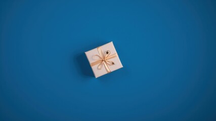 Wall Mural - A Single Small Gift Box with a Light Beige Ribbon Bow on a Blue Background