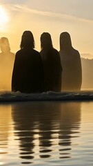 Wall Mural - group of individuals silhouetted by sunset near water, creating a serene and mystical atmosphere in 