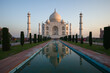 © Matteo Colombo - Taj Mahal mausoleum at sunrise reflected in water, Agra, India