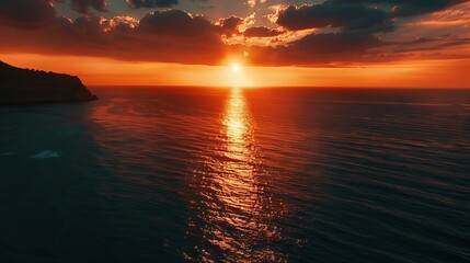 Wall Mural - vibrant sunrise casting golden hues over the serene sea, colorful sky reflecting on calm ocean water