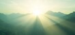 © CHONCHANOK PHOTO - A breathtaking view of mountains illuminated by sun rays, creating a mystical atmosphere in nature.