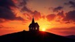 © achmad - Small church on hilltop at vibrant sunset.