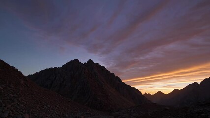 Aufkleber - Sunset view over rocky mountain landscape with colorful sky display