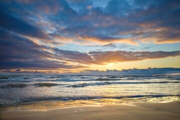 Wall Mural - Sea coast. Different sky. Beautiful sunset.