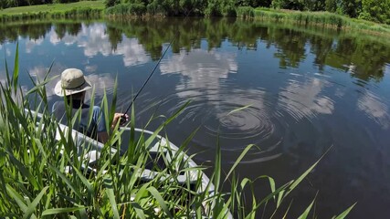 Aufkleber - Kayaking on a tranquil river surrounded by tall grass and reflecting clouds