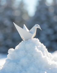 Canvas Print - A white origami bird sitting on top of a pile of snow