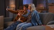 © kinomaster - A young man and woman are in the living room discussing a housewarming.