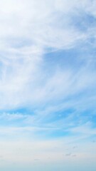 Wall Mural - Sky with light and airy cumulus clouds. Abstract blue background with summer sky.
