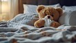 © Fitriyani - A teddy bear is sick and is resting in bed with a tissue.