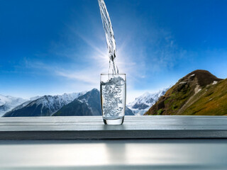 Aufkleber - Crystal clear water pours into a glass, set against a breathtaking mountain vista.  Sunlight streams through the scene, highlighting the purity of nature.