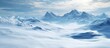© CreativeBro - Serene winter snow landscape with majestic mountains and a soft blue sky creating a peaceful and tranquil atmosphere