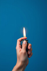 Poster - Hand holding a lighter with a flame