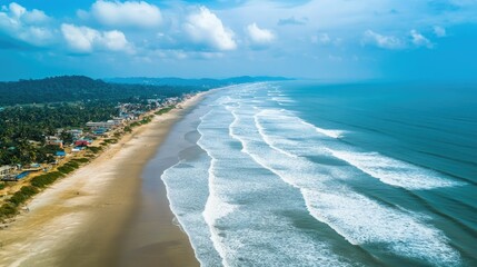 Wall Mural - Scenic Aerial View of Tranquil Beach with Rolling Waves and Blue Sky