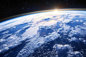 Poster - Stunning view of Earth from space with sunlight emerging over the horizon, casting a warm glow on clouds and atmosphere.