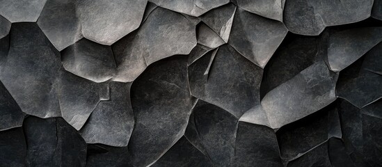 Poster - Jagged black stone wall with abstract textures creating a dark and intricate surface design for artistic and architectural concepts