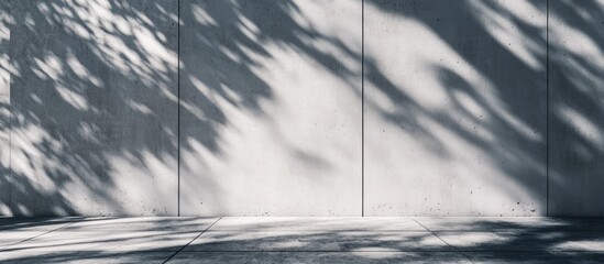 Poster - Intricate shadows creating minimalistic patterns on a textured cement wall emphasizing light and form in a serene environment