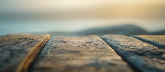 Wall Mural - Rustic wooden table surface with a blurred background ideal for enhancing interior design concepts and creative projects.