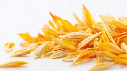 Poster - Close up of vibrant yellow safflower petals arranged artistically on a clean white background for natural beauty and culinary themes