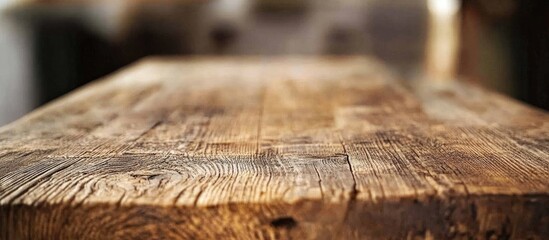 Wall Mural - Rustic wooden table close up with blurred background ideal for home decor or restaurant ambiance showcasing warmth and charm