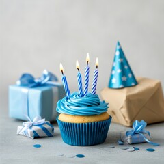 Wall Mural - Celebratory cupcake with blue frosting and candles among gifts for a party