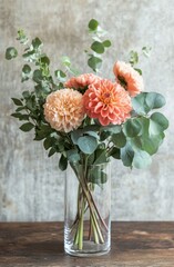 Poster - Beautiful floral arrangement with peach dahlias and eucalyptus in a glass vase