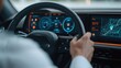 © Peter@studio5 - A modern car interior features a driver gripping the steering wheel, with a digital dashboard displaying navigation and vehicle information.