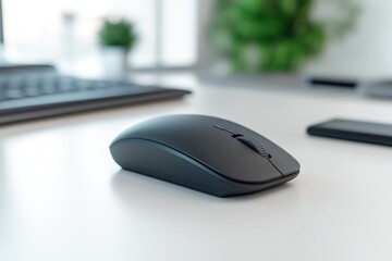 Poster - A black computer mouse is sitting on a white desk. There is a keyboard and a cell phone on the desk