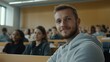 © Business Image - Engaged classroom setting with smiling student in gray hoodie