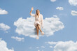 © Ljupco Smokovski - Beautiful young woman in a bathrobe sitting on a cloud