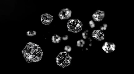 Poster - Sparkling ice crystals falling on black background.