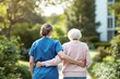 © PlanetOfVectors - Caregiver assisting elderly woman outdoors, walking arm-in-arm in a serene garden setting. Natural lighting highlights care and support concept. Ai generative
