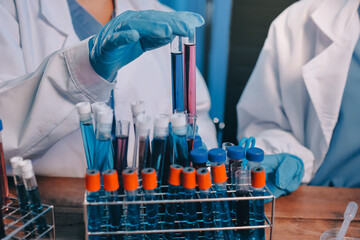 blood test in the laboratory. laboratory assistant working with the dispenser. vacuum tubes with blo