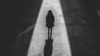 © HambaTuhanImages - Solitary figure in spotlight, black and white.