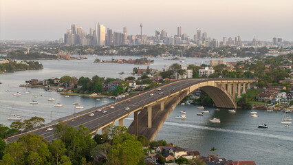 Wall Mural - the gladesville bridge spanning the parramatta river at drummoyne with the sydney skyline in the bac