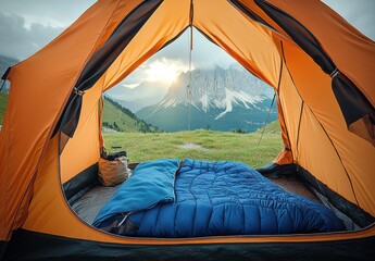 a tent with a blue blanket and a view of mountains
