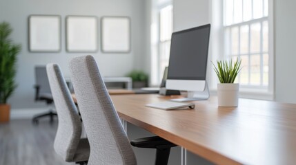 Poster - Modern office space featuring ergonomic chairs, computer, and natural light